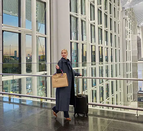 a passenger walking towards her flight at new istanbul airport