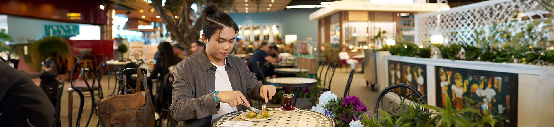 a passenger eating her food at the istanbul airport