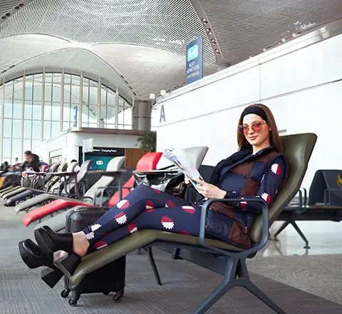 a passenger resting in the comfortable chairs of istanbul airport 
